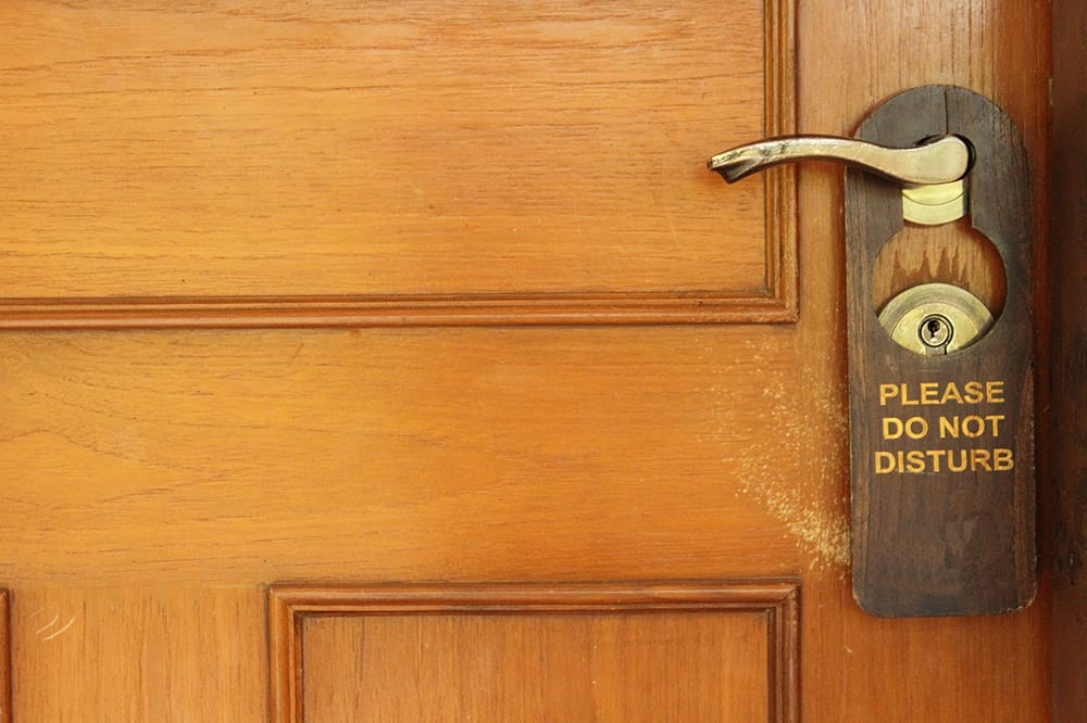 Do Not Disturb sign on hotel door