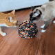 two cats playing with a snuffle ball, a cat enrichment toy