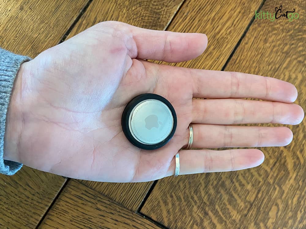 Apple AirTag in the palm of a hand