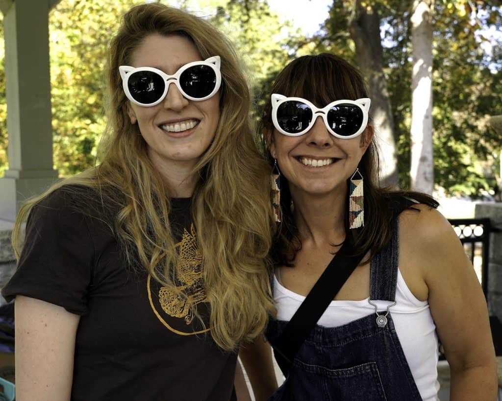 two women wearing cat sunglasses