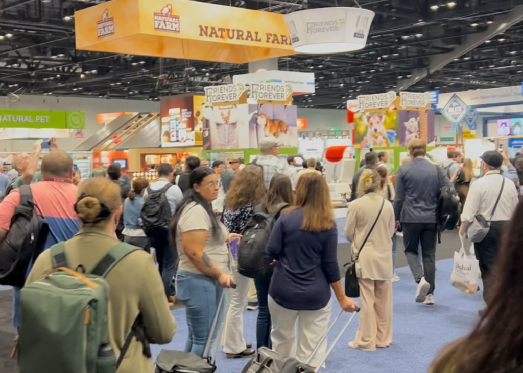 people on the show room floor at Global Pet Expo 2025